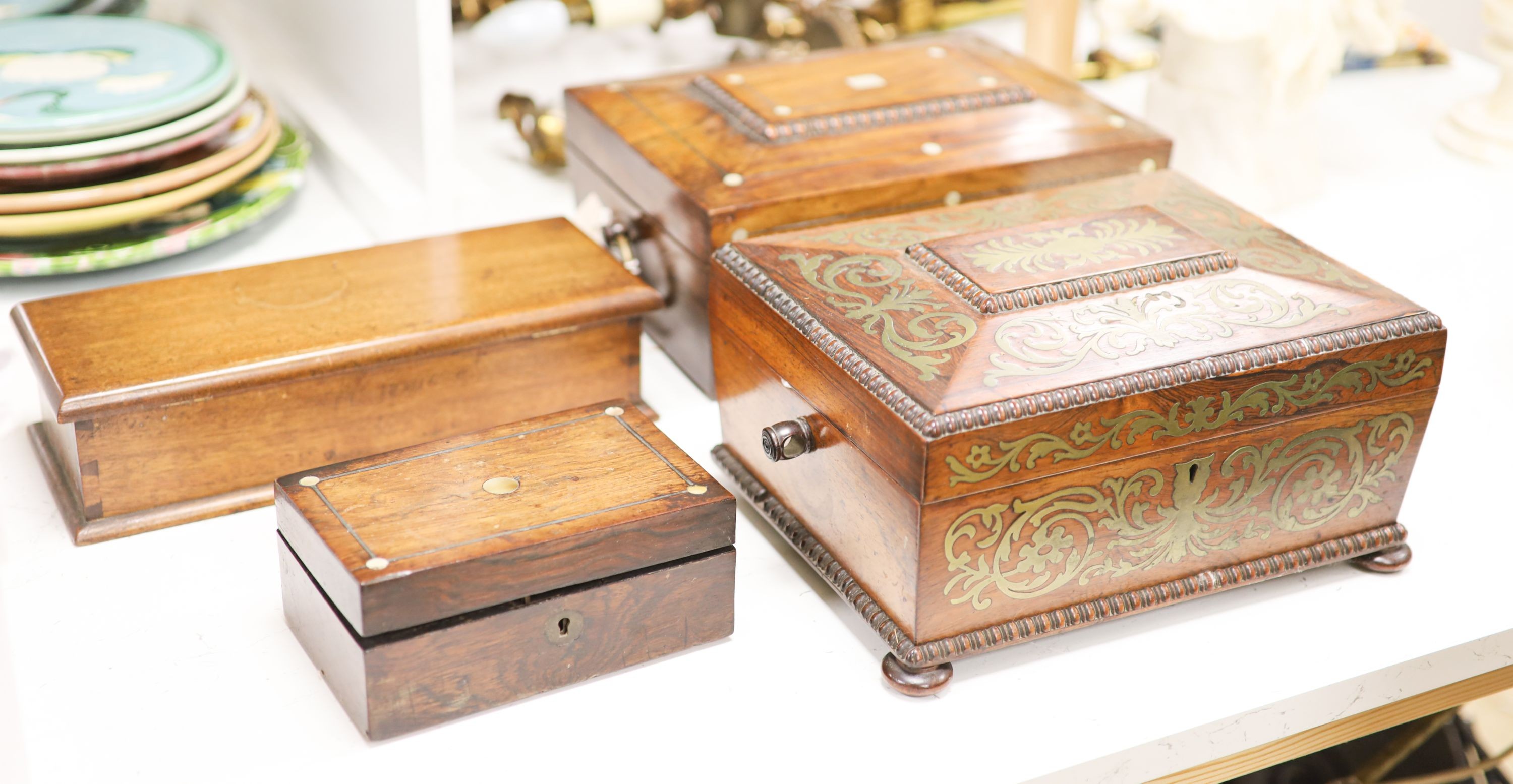 A Regency cut brass inlaid rosewood sewing box and three other boxes